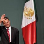 Enrique Pena Nieto, presidential candidate of the Institutional Revolutionary Party (PRI), waves after exit polls showed him in first place, in Mexico City July 1, 2012. REUTERS/Tomas Bravo
