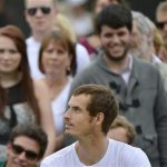 Andy Murray of Britain is watched by spectators during a training session at the Wimbledon tennis championships in London July 5, 2012. REUTERS/Toby Melville