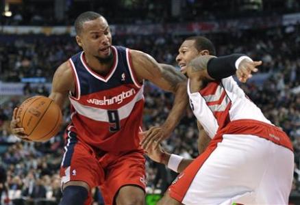 Washington Wizards forward Rashard Lewis elbows Toronto Raptors forward James Johnson (R) during the first half of their NBA basketball game in Toronto February 3, 2012. REUTERS/Mike Cassese