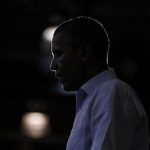 U.S. President Barack Obama is silhouetted during a campaign rally at Phoebus High School in Hampton, Virginia, July 13, 2012. REUTERS/Jason Reed