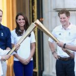 Olympic torch greeted by royals at Buckingham Palace