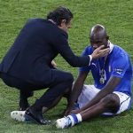 Italy's coach Cesare Prandelli (L) comforts Mario Balotelli after the game against Spain at the Euro 2012 final soccer match at the Olympic Stadium in Kiev, July 1, 2012. REUTERS/Michael Dalder