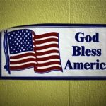 A decal reading "God Bless America" is seen on the wall of the soup kitchen in the basement of the St. Leo Catholic Church in Detroit December 17, 2011. REUTERS/Mark Blinch