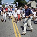 U.S. Republican presidential candidate and former Massachusetts Governor Mitt Romney crosses the street as he takes part in the Wolfeboro Fourth of July Parade in Wolfeboro, New Hampshire July 4, 2012. REUTERS/Jessica Rinaldi