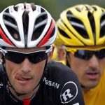RadioShack-Nissan rider Frank Schleck (L) of Luxembourg cycles with teammate rider and leader's yellow jersey Fabian Cancellara of Switzerland during the third stage of the 99th Tour de France cycling race between Orchies and Boulogne sur mer July 3, 2012. REUTERS/Stephane Mahe