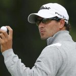 Adam Scott of Australia acknowledges the crowd after making his putt on the first green during the first round of the British Open golf championship at Royal Lytham & St Annes, northern England July 19, 2012. REUTERS/Brian Snyder