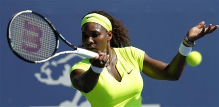 Serena Williams returns a shot against Nicole Gibbs during the Bank of the West Classic women's tennis tournament on the Stanford University campus in Palo Alto, California, July 11, 2012. REUTERS/Robert Galbraith