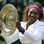 Serena Williams of the U.S. holds her trophy after defeating Agnieszka Radwanska of Poland in their women's final tennis match at the Wimbledon tennis championships in London July 7, 2012. REUTERS/Dylan Martinez