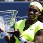 Serena Williams of the U.S. poses with the trophy after defeating compatriot Coco Vandeweghe during the finals of the Stanford women's tennis tournament on the Stanford University campus in Palo Alto, California July 15, 2012. REUTERS/Robert Galbraith