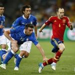 Spain's Andres Iniesta (R) challenges Italy's Andrea Barzagli during their Euro 2012 final soccer match at the Olympic stadium in Kiev, July 1, 2012. REUTERS/Kai Pfaffenbach