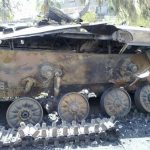 A damaged tank is seen in the suburb of Erbeen in Damascus July 22, 2012. REUTERS/Shaam News Network/Handout