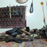 A member of rebel group Khaled ibin al Walid Fighters rests next to weapons in a temporary house used by rebels at Hamidiyeh district in the central city of Homs July 1, 2012. REUTERS/Yazen Homsy