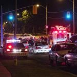 Police cars are seen at a crime scene following a shooting in Scarborough, a suburb in east Toronto, July 17, 2012. REUTERS/Mark Blinch
