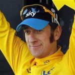 Sky Procycling rider Bradley Wiggins of Britain wears the leader's yellow jersey on the podium after the tenth stage of the 99th Tour de France cycling race between Macon and Bellegarde-sur-Valserine, July 11, 2012. REUTERS/Bogdan Cristel