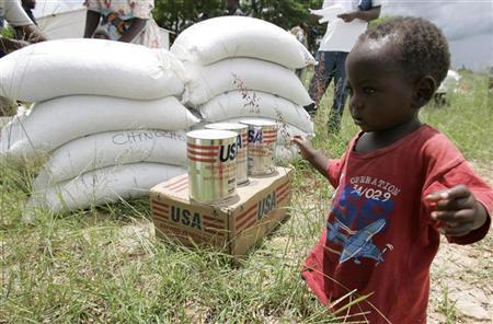 A boy walks at a food aid distribution centre in Chirumanzi, Zimbabwe. January 15, 2009. REUTERS/Philimon Bulawayo