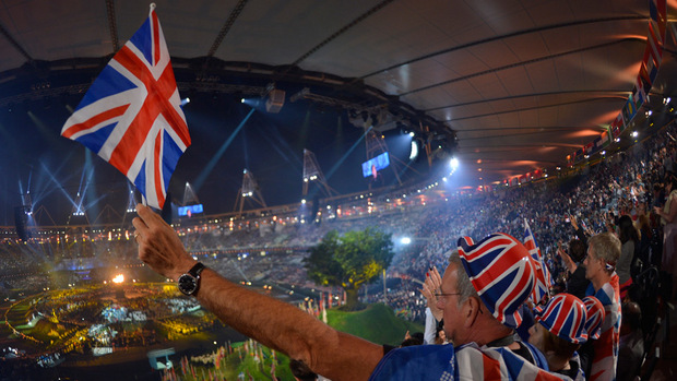 British-spectators-cheer-as-they-attend-the-opening-ceremony-of-the-London-Games-on-July-27.-Sundays-closing-ceremony-is-expected-to-showcase-generations-of-British-art-and-culture