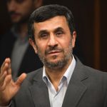 Iranian-President-Mahmoud-Ahmadinejad-waves-to-the-media-while-attending-for-an-official-meeting-with-Russias-Security-Council-chief-Nikolai-Patrushev-in-Tehran.