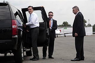 Mitt-Romney-gets-into-his-vehicle-upon-his-arrival-in-Charlotte