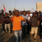 Striking-platinum-mineworkers-gather-for-a-report-back-on-negotiations-at-Lonmins-Marikana-mine-in-South-Africas-North-West-Province-August-29-2012