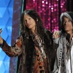 Steven Tyler (L) and Joe Perry of Aerosmith take the stage to introduce actor Johnny Depp, recipient of the MTV Generation Award, at the 2012 MTV Movie Awards in Los Angeles, June 3, 2012. REUTERS/Mario Anzuoni