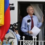 Wikileaks founder Julian Assange prepares to speak from the balcony of Ecuador's embassy, where he is taking refuge in London August 19, 2012. REUTERS/Chris Helgren