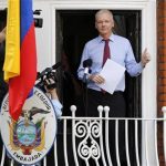 Wikileaks founder Julian Assange gestures as he prepares to speak from the balcony of Ecuador's embassy, where he is taking refuge in London August 19, 2012. REUTERS/Chris Helgren