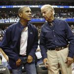 U.S. President Barack Obama (L) and Vice President Joe Biden take their seats for an Olympic basketball exhibition game between the U.S. and Brazil national men's teams in Washington, July 16, 2012. REUTERS/Jonathan Ernst