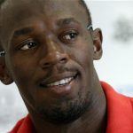 Jamaica's Usain Bolt smiles during a news conference ahead of the Athletissima Diamond League event in Lausanne, August 22, 2012. REUTERS/Denis Balibouse