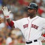 Boston Red Sox Carl Crawford slaps hands with a teammate after scoring a run against the Chicago White Sox during the first inning of American League MLB baseball action at Fenway Park in Boston, Massachusetts July 16, 2012. REUTERS/Jessica Rinaldi