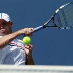 Andy Roddick of the U.S. hits a return to compatriot Rhyne Williams during their men's singles match at the U.S. Open tennis tournament in New York August 28, 2012. REUTERS/Kevin Lamarque