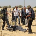 Egyptian security forces arrest suspected militants after a firefight at the al-Goura settlement in Egypt's north Sinai region, about 15 km (10 miles) from the border with Israel, August 12, 2012. REUTERS/Stringer