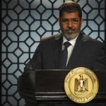 Egypt's President-elect Mohamed Mursi speaks during his first televised address to the nation at the Egyptian Television headquarters in Cairo June 24, 2012. REUTERS/Stringer