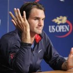 Switzerland's Roger Federer answers questions at a news conference ahead of the 2012 U.S. Open tennis tournament in New York August 25, 2012. REUTERS/Eduardo Munoz