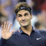 Roger Federer of Switzerland waves to the crowd after defeating Donald Young of the U.S. during their opening night men's singles match at the U.S. Open tennis tournament in New York, August 27, 2012. REUTERS/Bill Kostroun