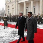 Armenian President Serzh Sargsyan (C) walks with Iran's President Mahmoud Ahmadinejad (R) during an official welcoming ceremony in Yerevan December 23, 2011. REUTERS/Tigran Mehrabyan/PanARMENIAN Photo/Handout