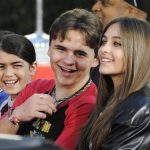 Michael Jackson's children (L-R) Blanket, Prince and Paris share a laugh at a ceremony where the singer is immortalized with hand and foot imprints in cement in the courtyard of Hollywood's Grauman's Chinese Theatre in Los Angeles January 26, 2012. REUTERS/Phil McCarten