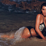 Kim Kardashian Shows Major Cleavage In Nocturnal Beach Photo Shoot