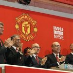Manchester United executives and owners Joel (3rd L) and Avram Glazer (2nd R) ring the opening bell in celebration of Manchester United Ltd initial public offering on the floor of the New York Stock Exchange, August 10, 2012. REUTERS/Brendan McDermid