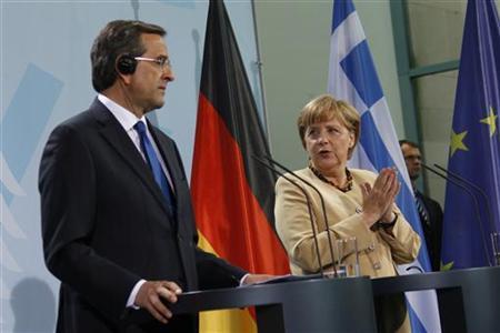 German Chancellor Merkel and Greek Prime Minister Samaras attend news conference after talks at Chancellery in Berlin German Chancellor Angela Merkel (R) and Greek Prime Minister Antonis Samaras attend a news conference after talks at the Chancellery in Berlin, August 24, 2012. REUTERS/Thomas Peter