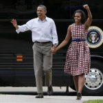 U.S. President Barack Obama and first lady Michelle Obama arrive by bus to speak at a campaign event at the Alliant Energy Amphitheater in Dubuque, Iowa, August 15, 2012. REUTERS/Larry Downing