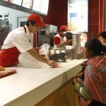 An Andean woman stands at the counter of a foreign fast food restaurant at a shopping mall in Huancayo city, in Peru's central Andes, August 17, 2012. REUTERS/Janine Costa