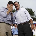 Republican U.S. presidential candidate Mitt Romney (R) smiles as vice president select U.S. Congressman Paul Ryan (R-WI) reacts arriving at a campaign event in Waukesha, Wisconsin August 12, 2012. REUTERS/Shannon Stapleton
