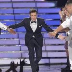 Host Ryan Seacrest arrives on the stage during the 11th season finale of "American Idol" in Los Angeles, California, May 23, 2012. REUTERS/Mario Anzuoni