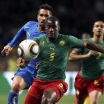 Cameroon's Sebastien Bassong (5) fights for the ball with Italy's Marco Borriello (back) during their international friendly soccer match at Louis II stadium in Monaco March 3, 2010. REUTERS/Sebastien Nogier
