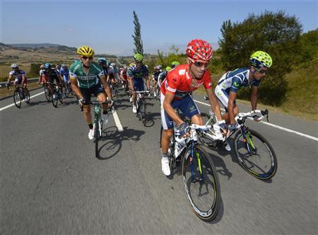 Movistar Team rider Valverde of Spain cycles during the fourth stage of the Tour of Spain "La Vuelta" cycling race between Barakaldo and Estacion de Valdezcaray Movistar Team rider Alejandro Valverde of Spain (C) cycles during the fourth stage of the Tour of Spain "La Vuelta" cycling race between Barakaldo and Estacion de Valdezcaray August 21, 2012. REUTERS/Felix Ordonez