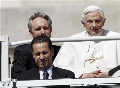 The Pope's butler, Paolo Gabriele (bottom L) arrives with Pope Benedict XVI (R) at St. Peter's Square in Vatican, in this file photo taken May 23, 2012. REUTERS/Alessandro Bianchi/Files