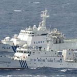 hinese marine surveillance ship cruising next to a Japan Coast Guard patrol ship in the East China Sea