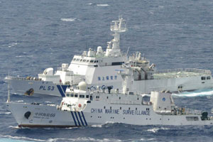 hinese marine surveillance ship cruising next to a Japan Coast Guard patrol ship in the East China Sea  
