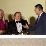 Macau Chief Executive Fernando Chui Sai-On chats with Las Vegas Sands Chairman and CEO Sheldon Adelson (C) and his wife Miriam Ochsorn (R) during the opening ceremony of Sheraton Macao hotel at Sands Cotai Central in Macau September 20, 2012. U.S. billionaire Adelson opened his latest resort in Macau on Thursday, adding to a string of casinos in the world's largest gambling destination that has helped the high-profile donor to the U.S. Republican party earn most of his multi-billion dollar fortune. REUTERS/Tyrone Siu