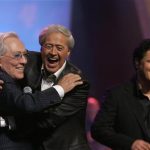Andy Williams (L) gets a hug from Wayne Osmond during a 50th anniversary show at the Orleans hotel-casino in Las Vegas, Nevada in this August 13, 2007 file photo. REUTERS/Steve Marcus/Files